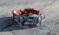 Preview: BioThane Halsband und Leine mit Markenband in dunkelrot mit weihnachtlichem Motiv im Detail